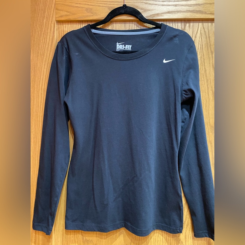 Nike Women’s black dri-fit long sleeve shirt, size medium. Slim fit.